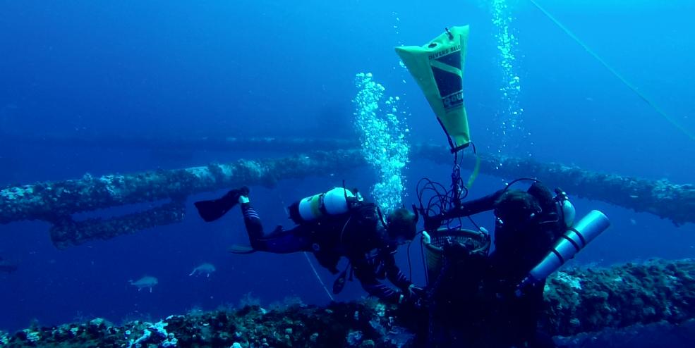 Scientists deploying a receiver at artificial reef MU-A-85